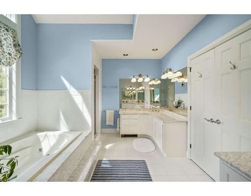 336 Lexington Road Concord, MA 01742 - Photo 16 of 29 a bathroom with a sink a mirror and a shower