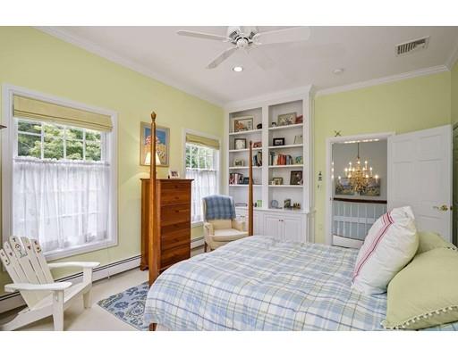 336 Lexington Road Concord, MA 01742 - Photo 17 of 29 a bedroom with a bed and furniture