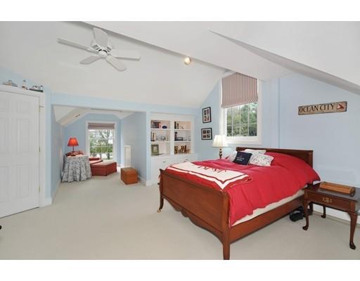 336 Lexington Road Concord, MA 01742 - Photo 20 of 29 a bed room with a bed and a chair