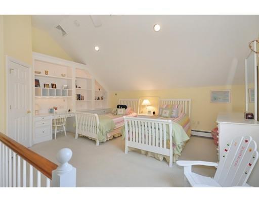 336 Lexington Road Concord, MA 01742 - Photo 21 of 29 a bedroom with furniture and a wooden floor