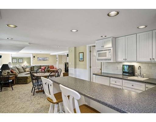 336 Lexington Road Concord, MA 01742 - Photo 24 of 29 a living room with stainless steel appliances kitchen island granite countertop furniture and a view of kitchen
