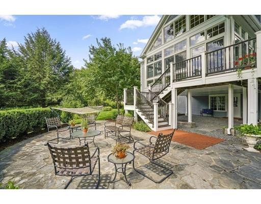 336 Lexington Road Concord, MA 01742 - Photo 25 of 29 a view of a patio with table and chairs and potted plants