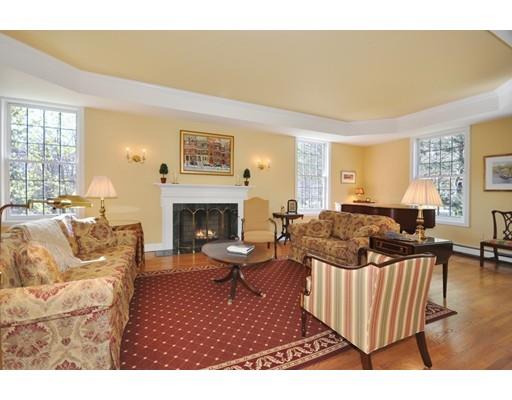 336 Lexington Road Concord, MA 01742 - Photo 7 of 29 a living room with furniture wooden floor and a fireplace