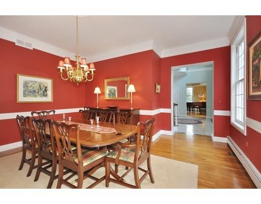 336 Lexington Road Concord, MA 01742 - Photo 8 of 29 a view of a dining room with furniture and a chandelier