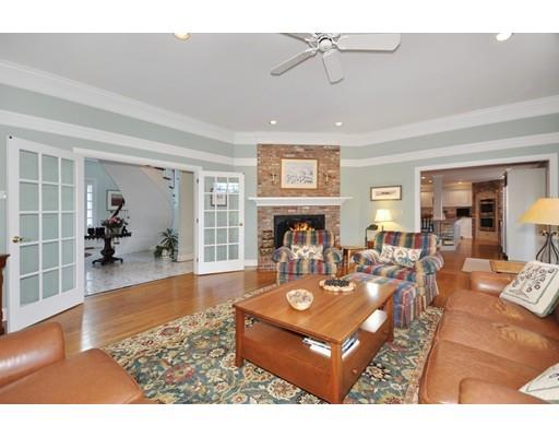336 Lexington Road Concord, MA 01742 - Photo 9 of 29 a living room with furniture a dining table and a fireplace