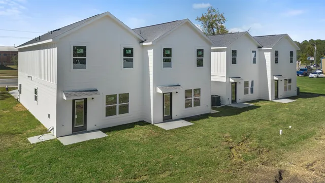 a view of backyard with barbeque grill and plants