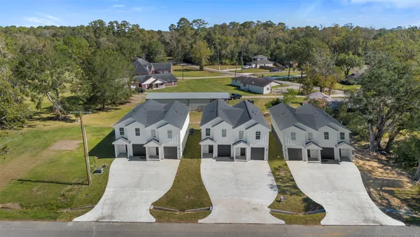 a aerial view of a house with a yard