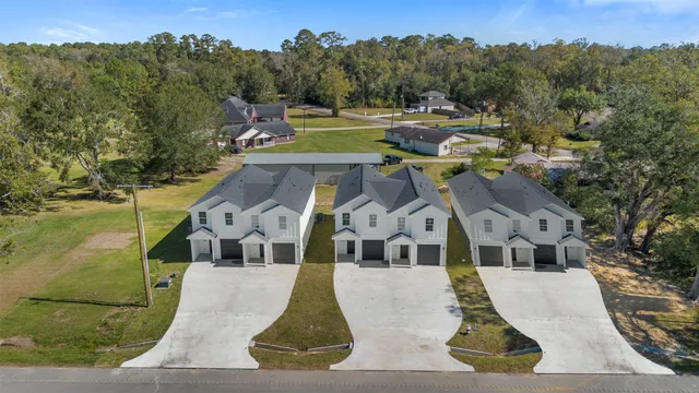 a aerial view of a house with a yard