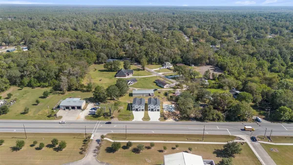 an aerial view of residential houses with outdoor space