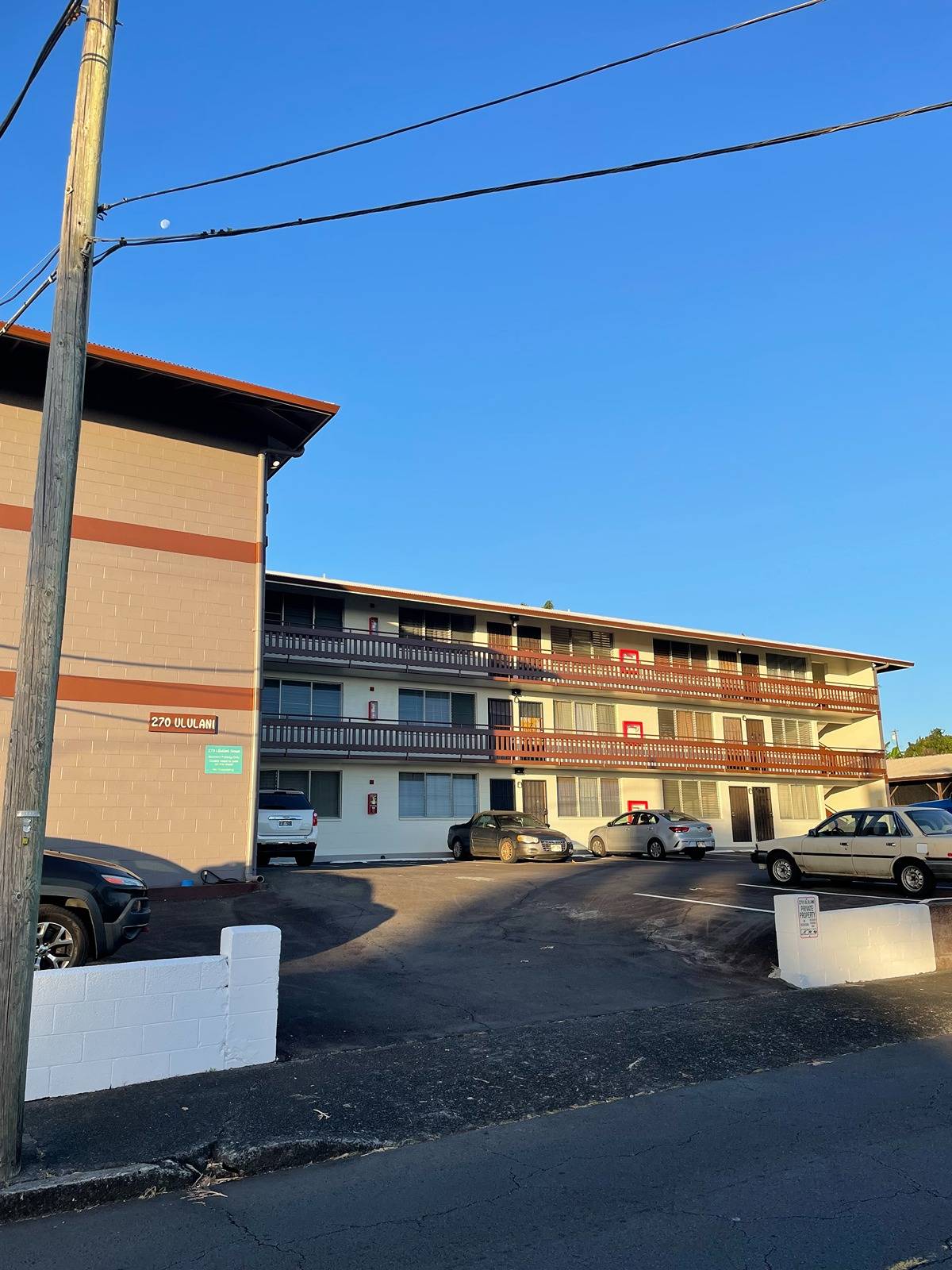 270 Ululani Street, Unit 22 Hilo, HI 96720 - Photo 1 of 13 a view of a street with cars