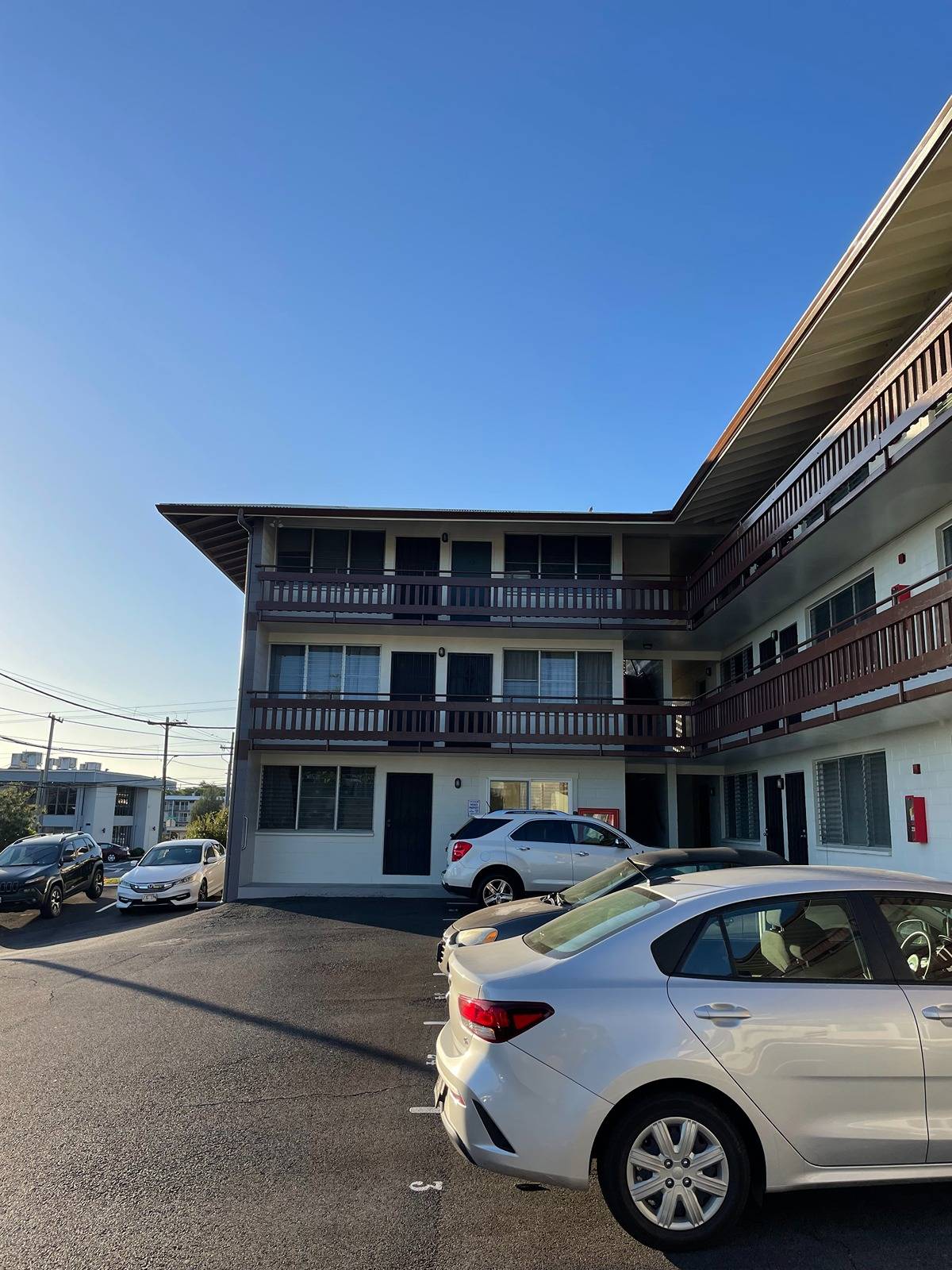 270 Ululani Street, Unit 22 Hilo, HI 96720 - Photo 2 of 13 a front view of a house with parking space