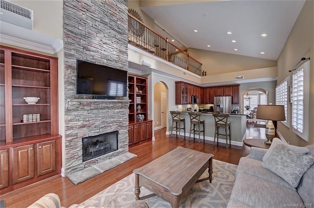 405 Halyard Lane Tega Cay, SC 29708 - Photo 19 of 48 a living room with furniture a flat screen tv and a fireplace