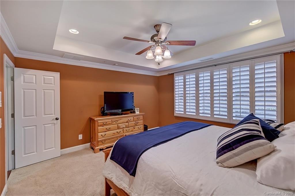 405 Halyard Lane Tega Cay, SC 29708 - Photo 25 of 48 a bedroom with a bed and a flat screen tv