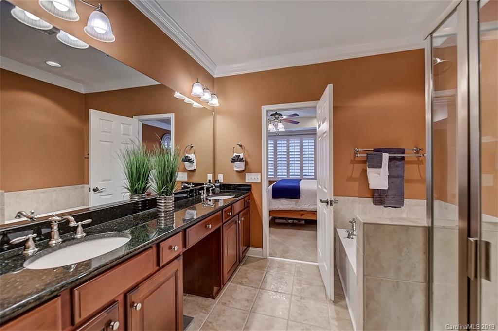 405 Halyard Lane Tega Cay, SC 29708 - Photo 27 of 48 a spacious bathroom with a sink double vanity granite and a mirror