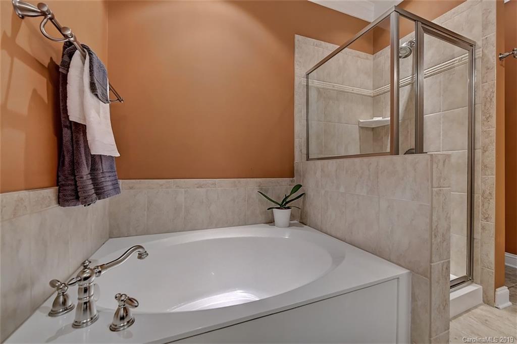 405 Halyard Lane Tega Cay, SC 29708 - Photo 28 of 48 a bathroom with a tub and a shower