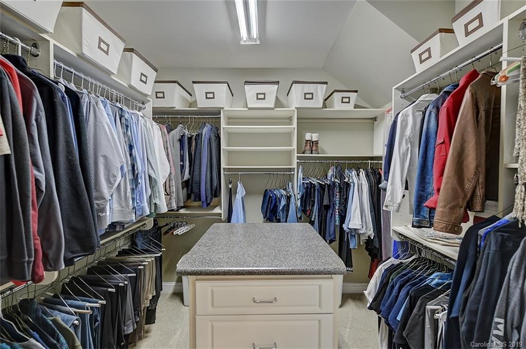 405 Halyard Lane Tega Cay, SC 29708 - Photo 29 of 48 a view of walk in closet with clothes and shoes