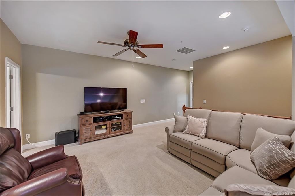 405 Halyard Lane Tega Cay, SC 29708 - Photo 36 of 48 a living room with furniture and a flat screen tv