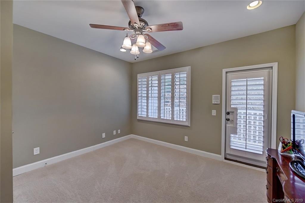 405 Halyard Lane Tega Cay, SC 29708 - Photo 39 of 48 en empty room with windows and ceiling fan