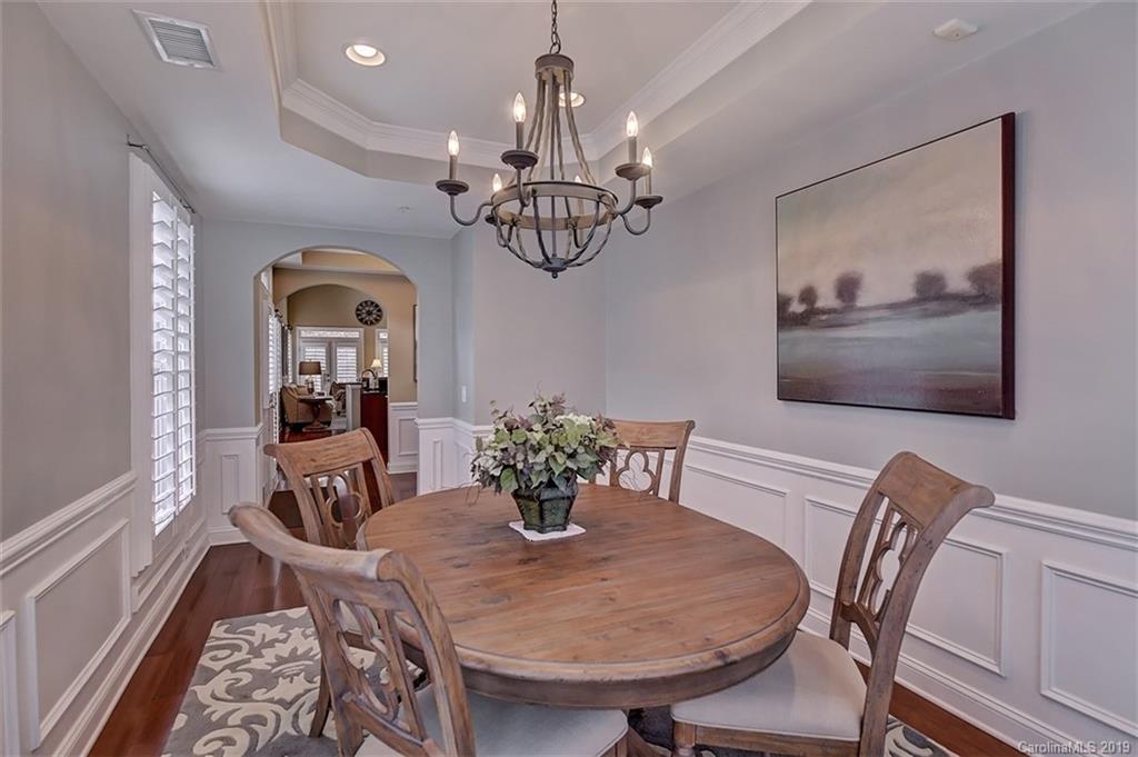 405 Halyard Lane Tega Cay, SC 29708 - Photo 5 of 48 a view of a dining room with furniture a chandelier and wooden floor