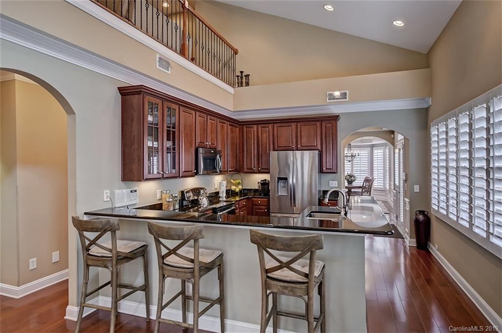 405 Halyard Lane Tega Cay, SC 29708 - Photo 10 of 48 a kitchen with stainless steel appliances granite countertop a sink and cabinets