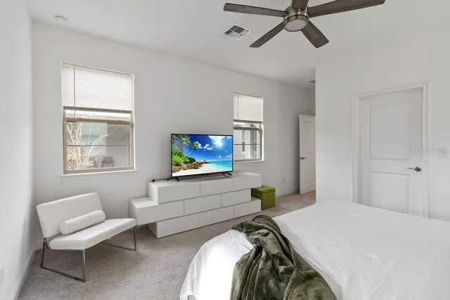 a bathroom with a sink double vanity granite tub shower and a mirror