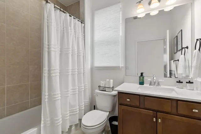 a bedroom with a bed a desk and chair