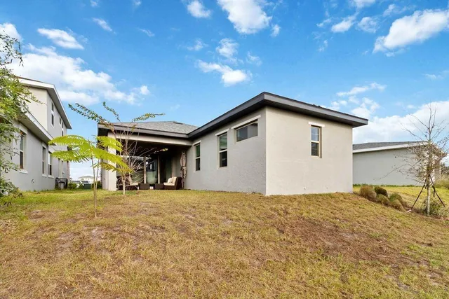 a house view with a backyard space