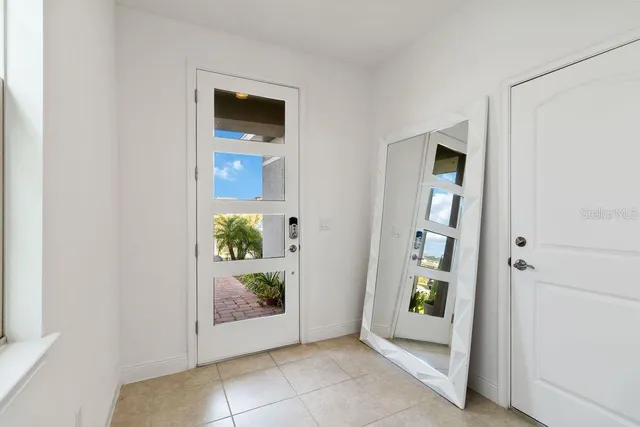 an empty room with window and door