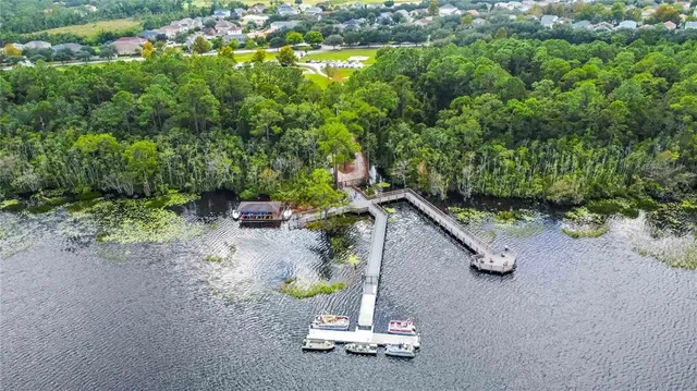 an aerial view of a house with a swimming pool yard and outdoor seating