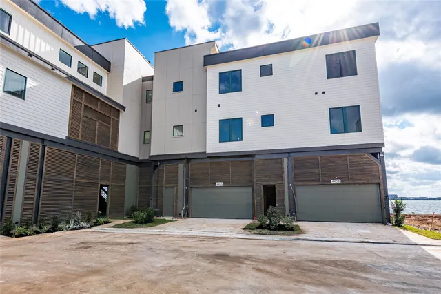 a front view of a building with garage