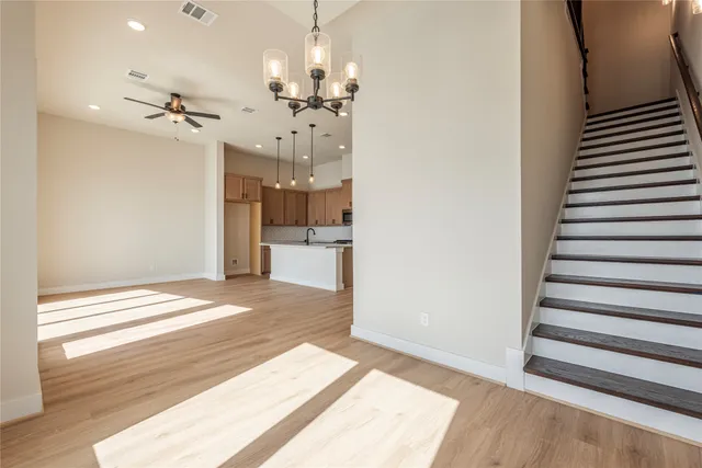 a spacious bathroom with a double vanity sink a mirror and shower