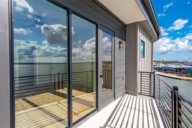 a large kitchen with cabinets wooden floor and stainless steel appliances