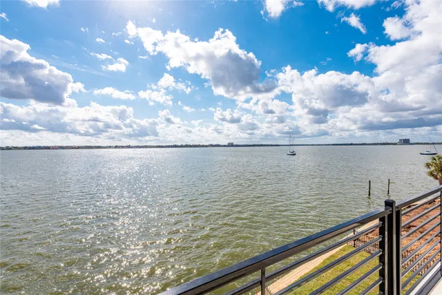 a kitchen with a sink and large window