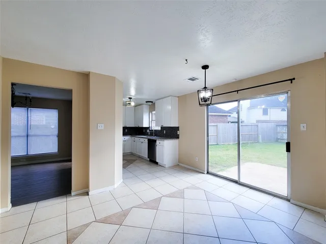 a view of a kitchen with an empty space and a kitchen