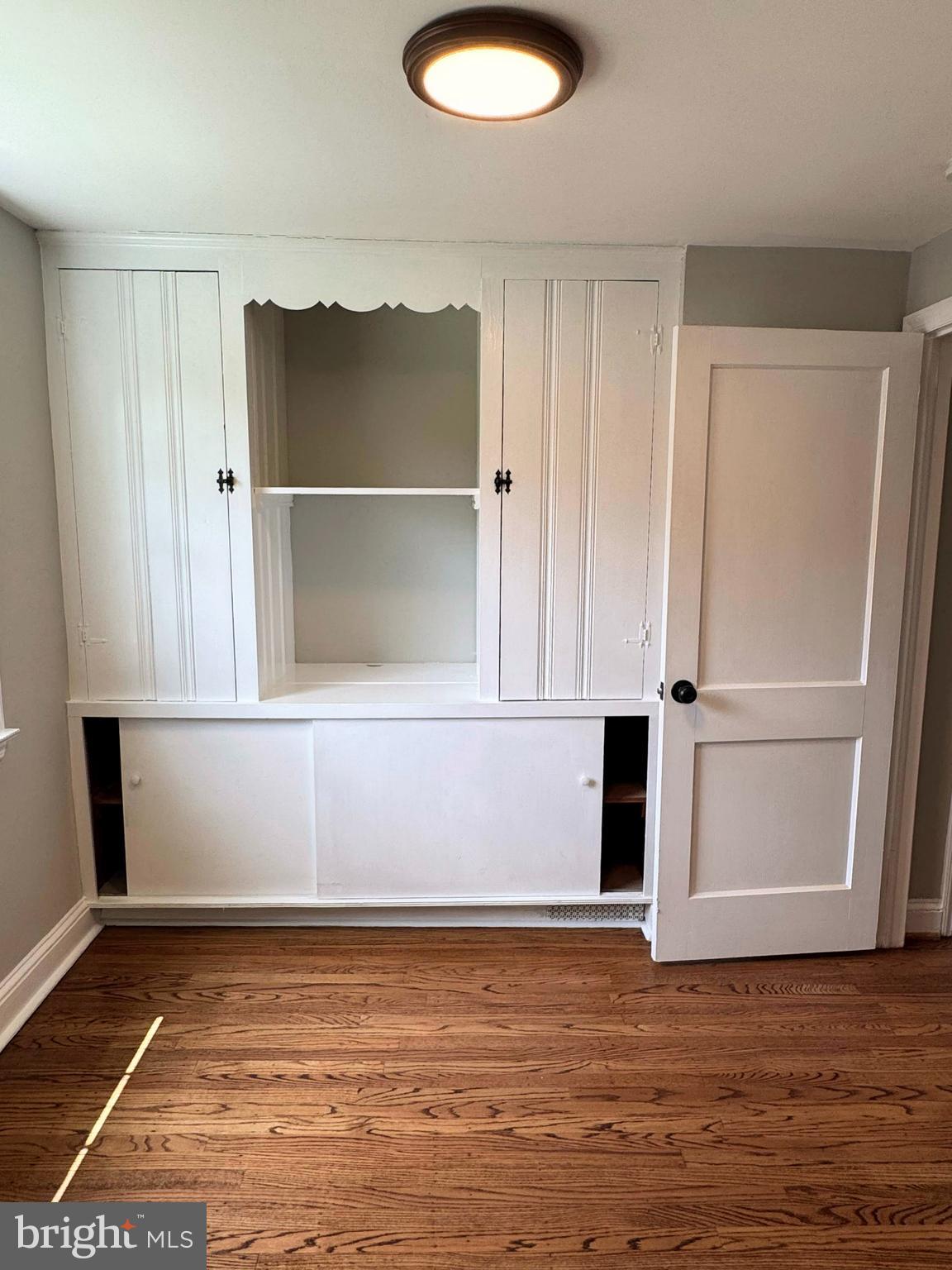 563 Rutherford Drive Springfield, PA 19064 - Photo 11 of 28 a view of a room with wooden floor and cabinet