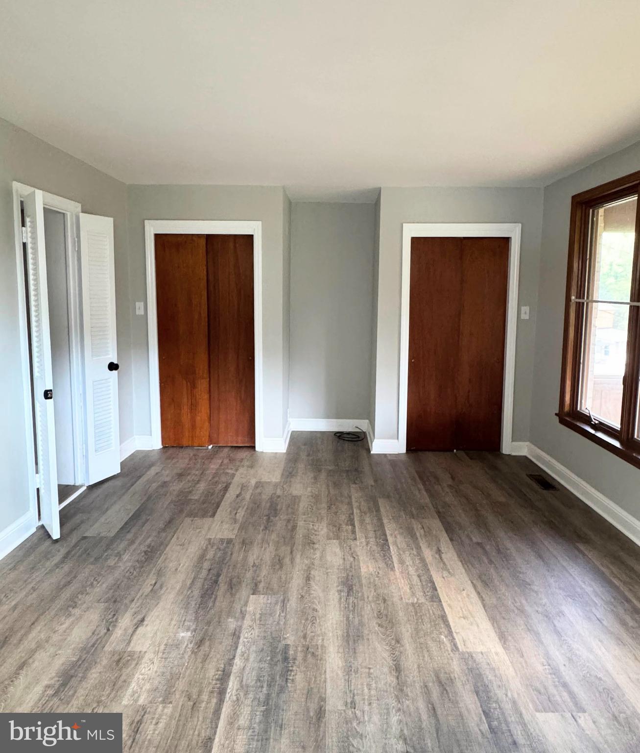 563 Rutherford Drive Springfield, PA 19064 - Photo 15 of 28 a view of empty room with window and wooden floor