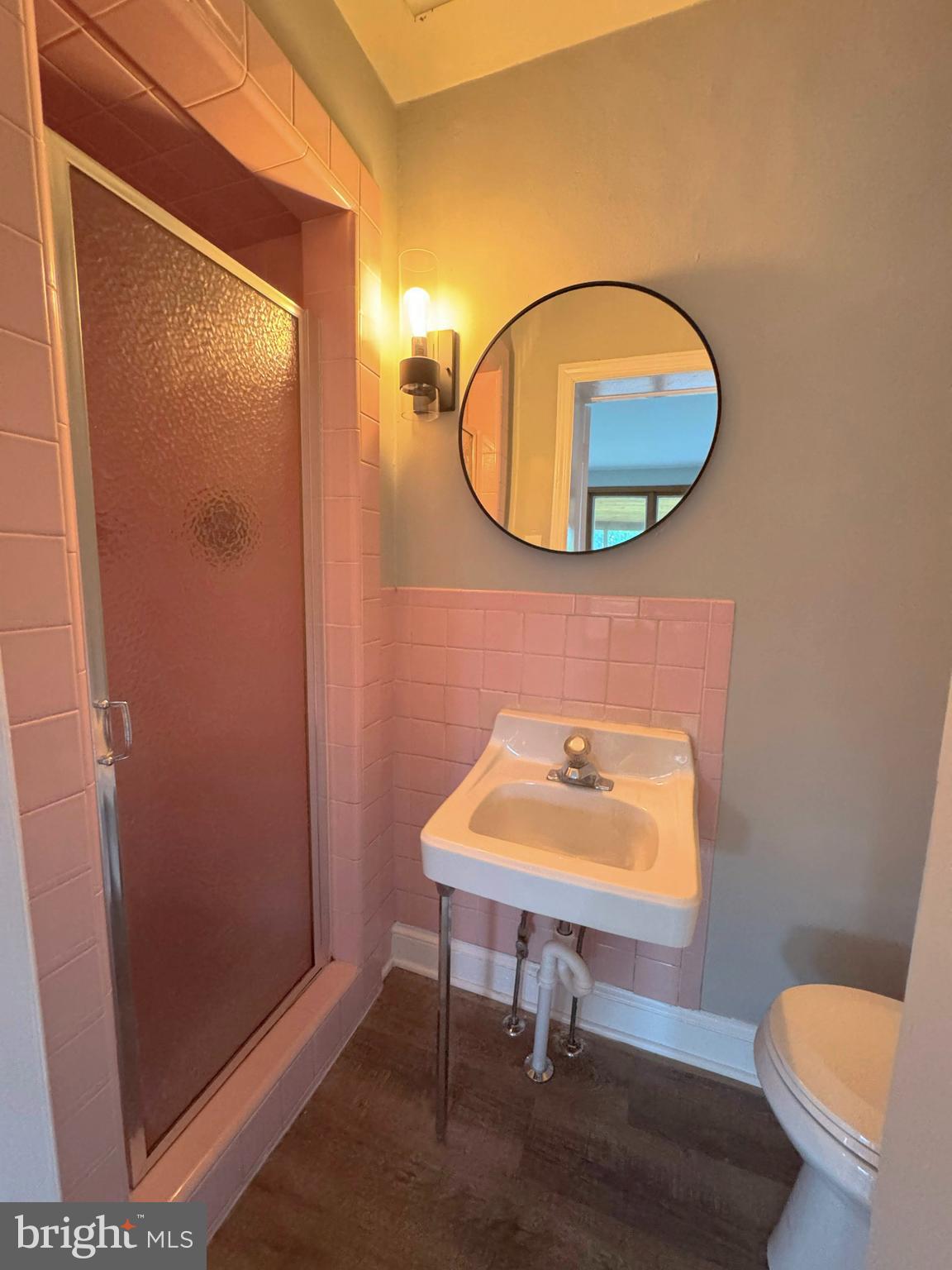 563 Rutherford Drive Springfield, PA 19064 - Photo 18 of 28 a bathroom with a toilet and a mirror