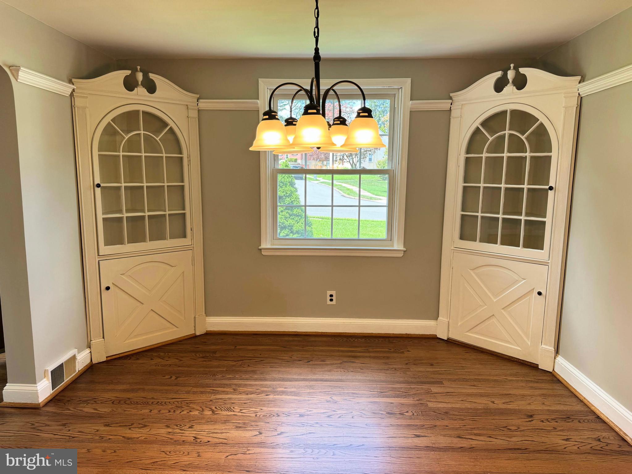 563 Rutherford Drive Springfield, PA 19064 - Photo 6 of 28 an empty room with wooden floor and windows