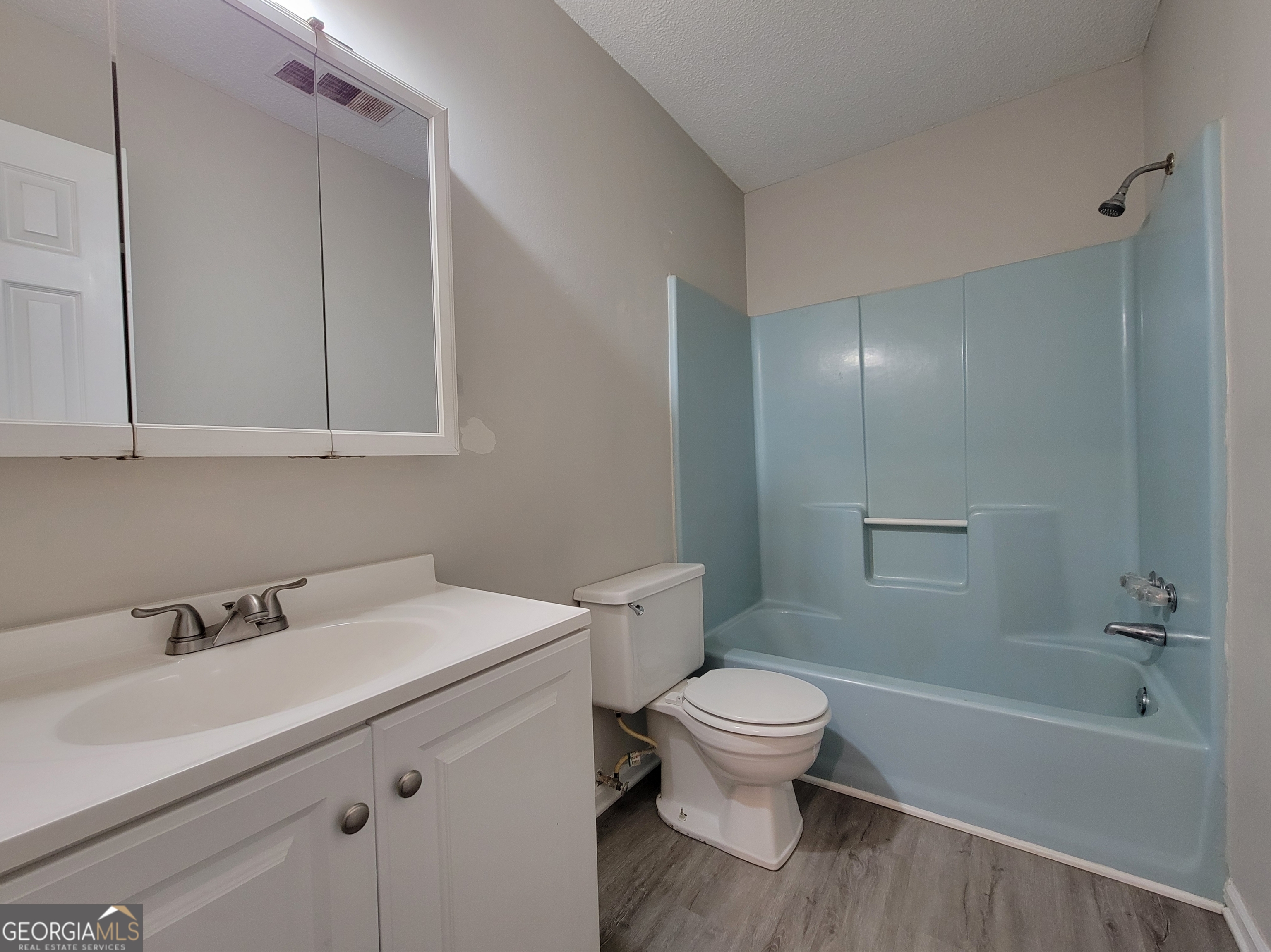 422 Highway 211 Street Northwest, Unit F Winder, GA 30680 - Photo 7 of 9 a bathroom with a sink a toilet and shower