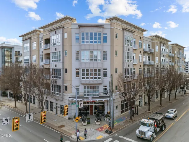 a front view of a building with parking