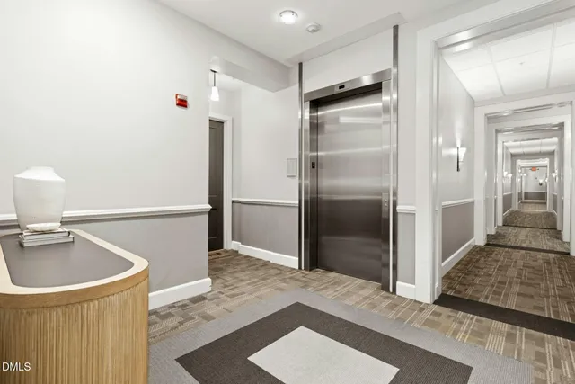 a kitchen with a refrigerator and a sink