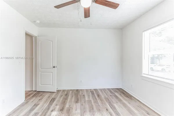 a view of an empty room and window