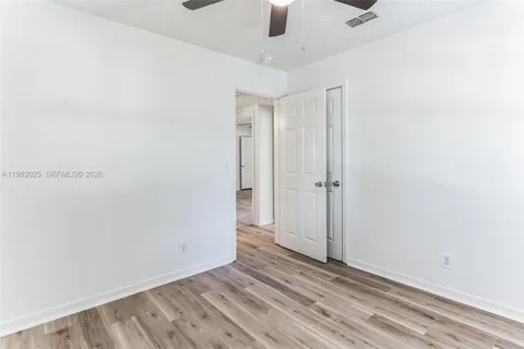 an empty room with a empty space and windows