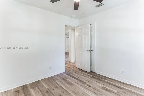 an empty room with a empty space and windows