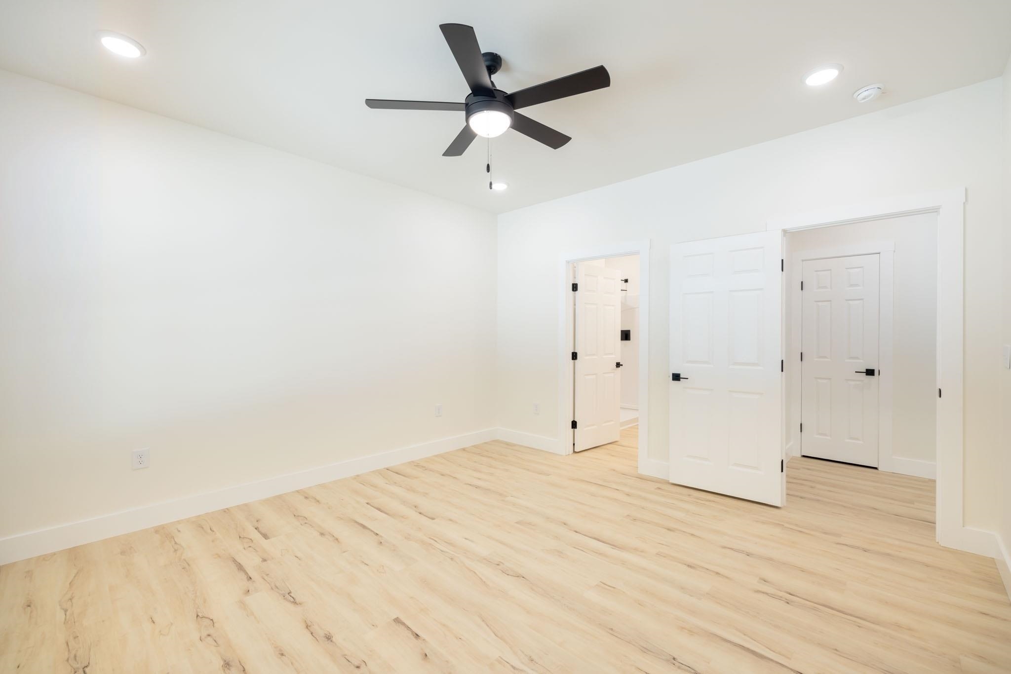 37 William Teague Lane Ramer, TN 38367 - Photo 23 of 39 Spacious interior featuring wood-finish flooring, recessed lighting, and a black ceiling fan
