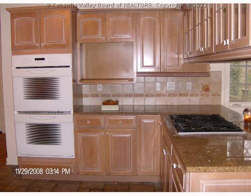 1430 Nottingham Road Charleston, WV 25314 - Photo 4 of 8 Kitchen. KraftMade Pickled Maple Cabinets, Jenn Air double convect oven, gas range top, GRANITE countertops, see thru glass cabinets above the range, ceramic tile on floor