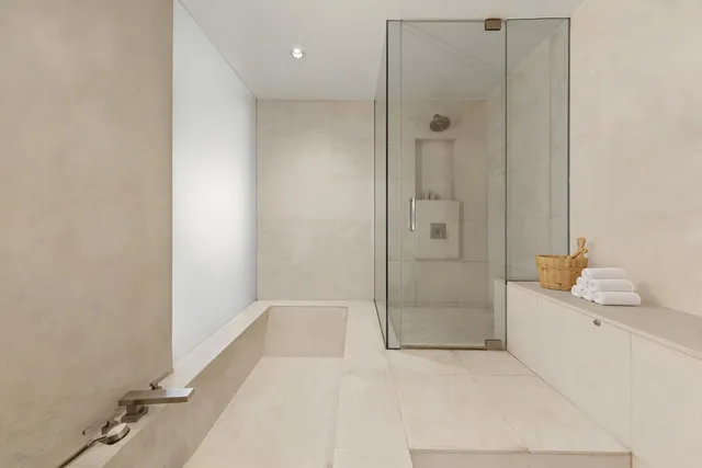 a bathroom with a bathtub and shower