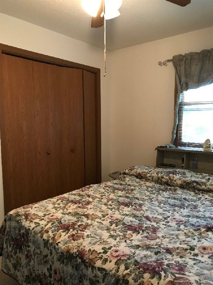 515 South 12th Street Rochelle, IL 61068 - Photo 11 of 25 a bedroom with a bed and a window