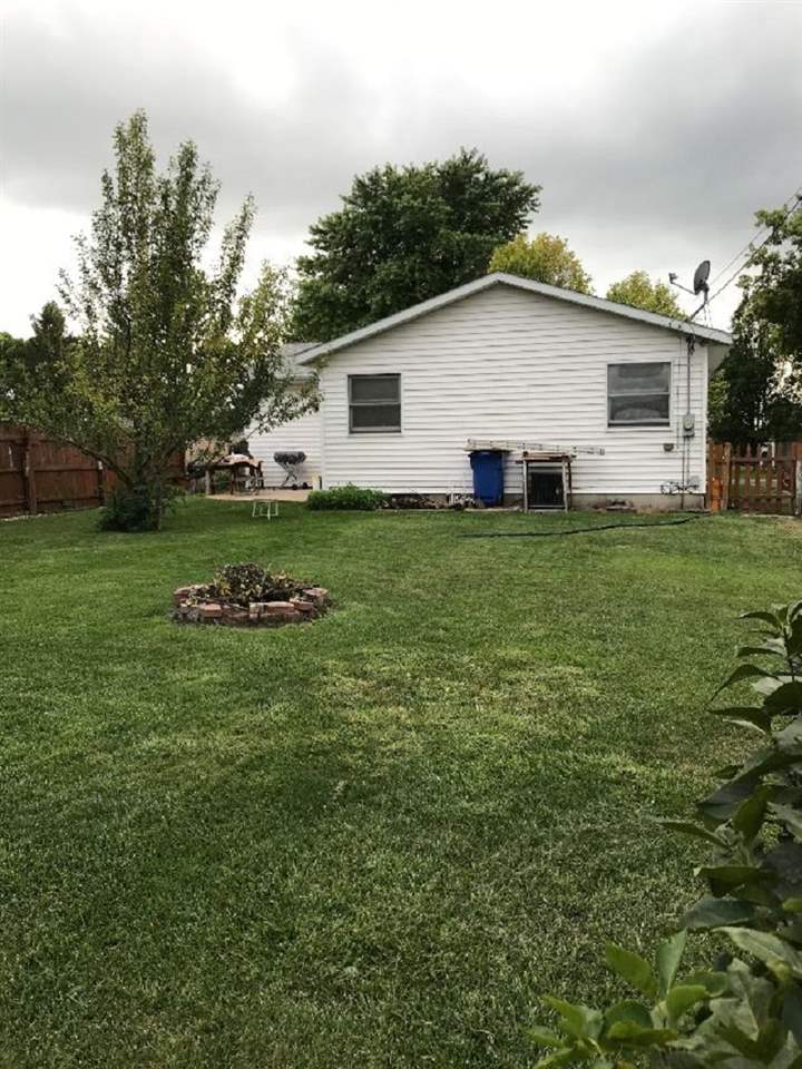 515 South 12th Street Rochelle, IL 61068 - Photo 20 of 25 a view of a backyard with plants and large trees