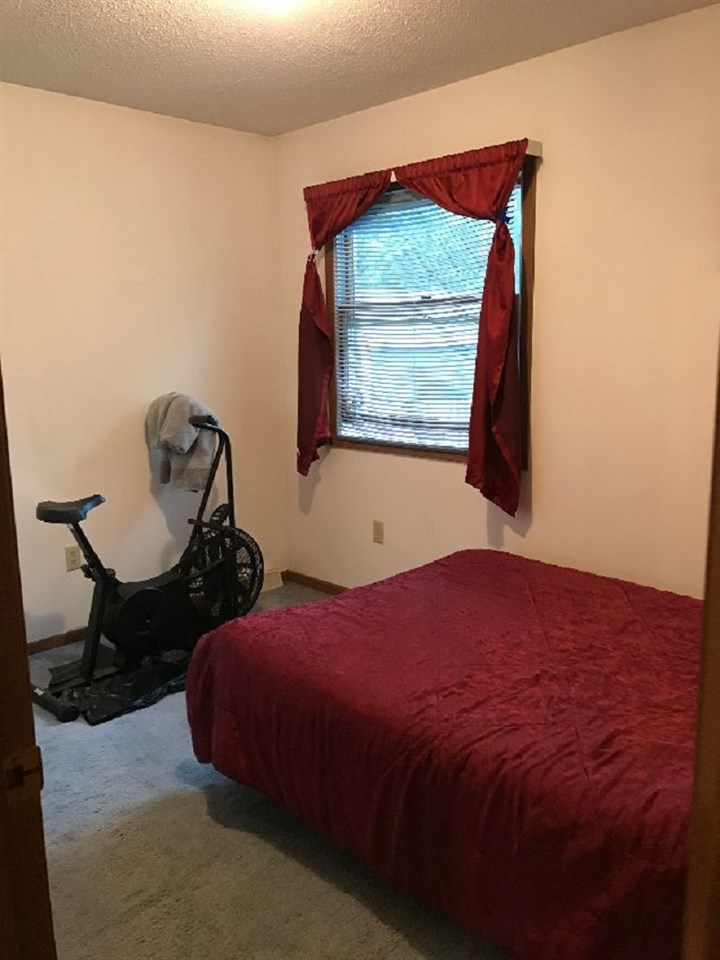 515 South 12th Street Rochelle, IL 61068 - Photo 9 of 25 a bedroom with a bed and window